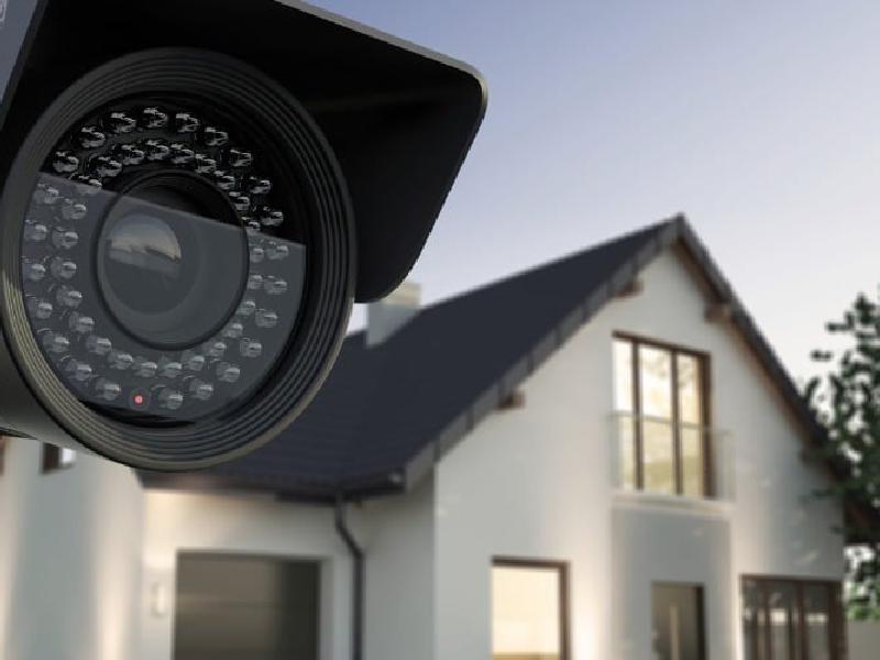 Security camera mounted on a house
