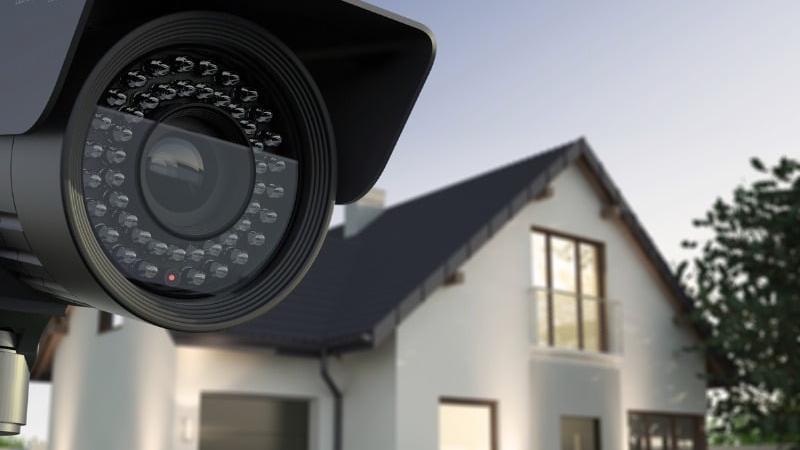Security camera mounted on a house