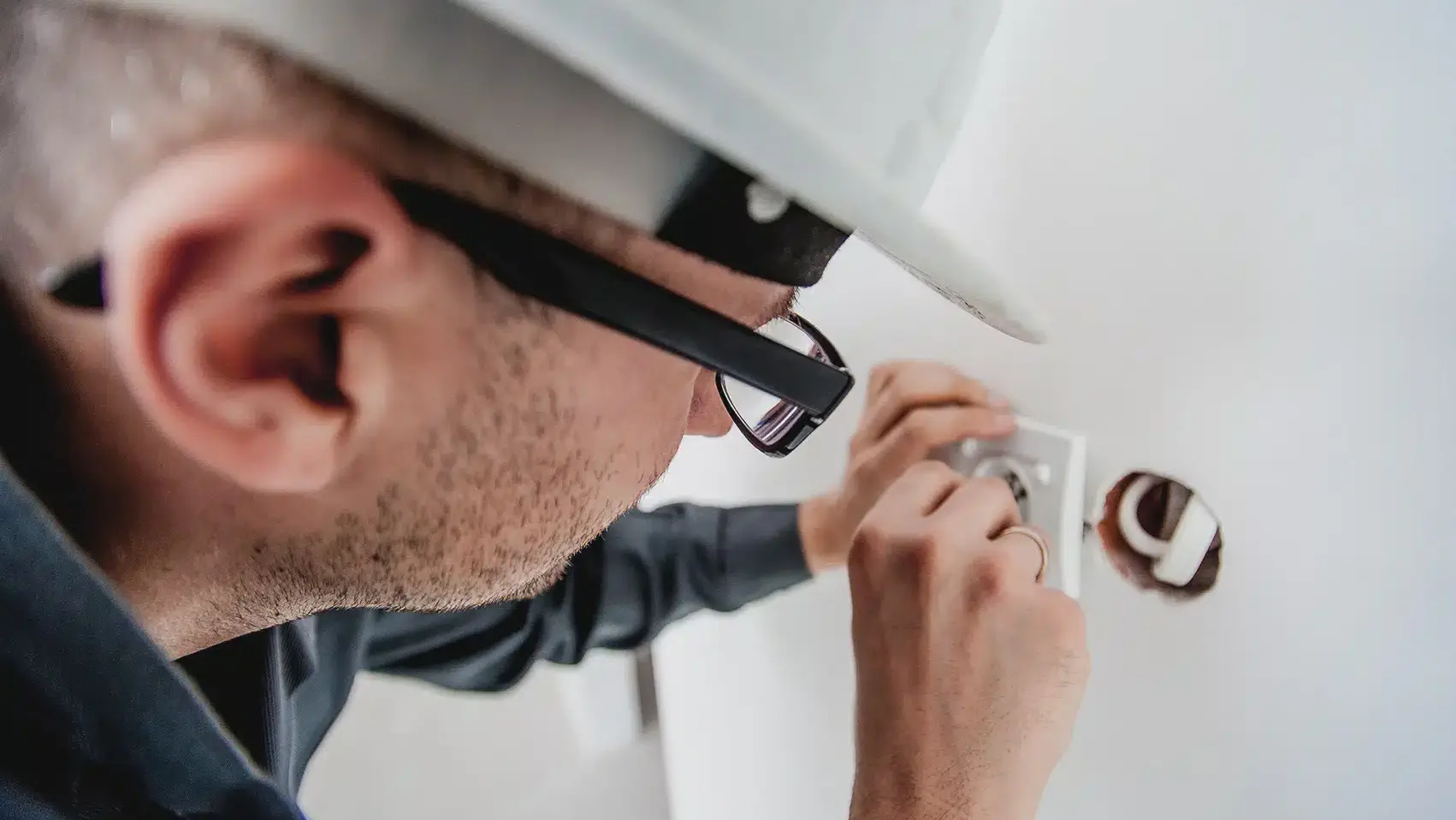 Carda Electrics electrician inspecting wiring in a Mordialloc home