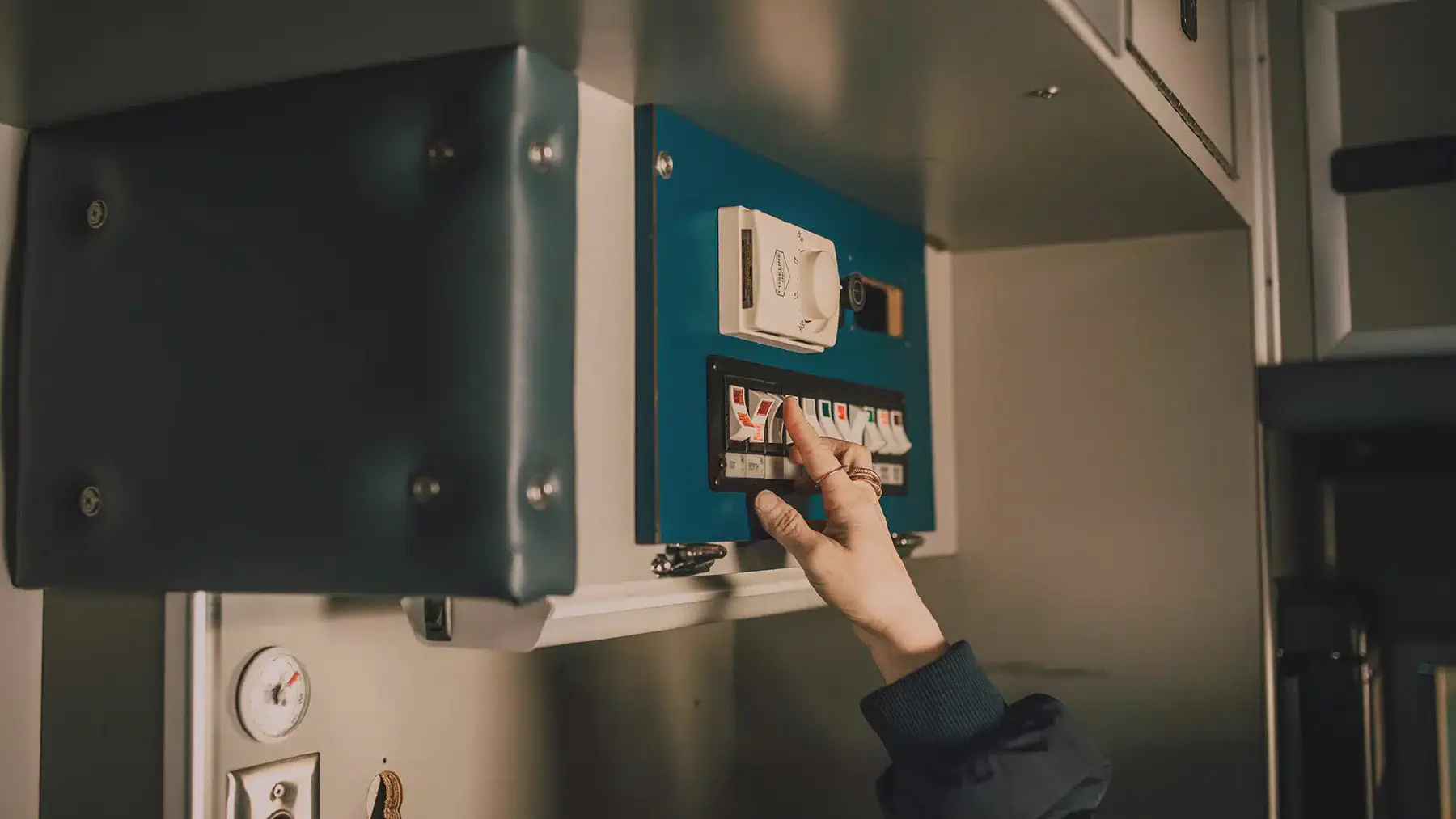 An open residential switchboard showing circuit breakers and safety switches